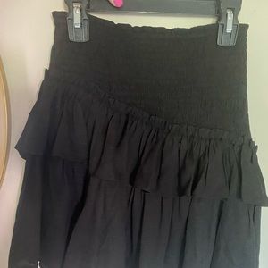 Black ruffle mini skirt